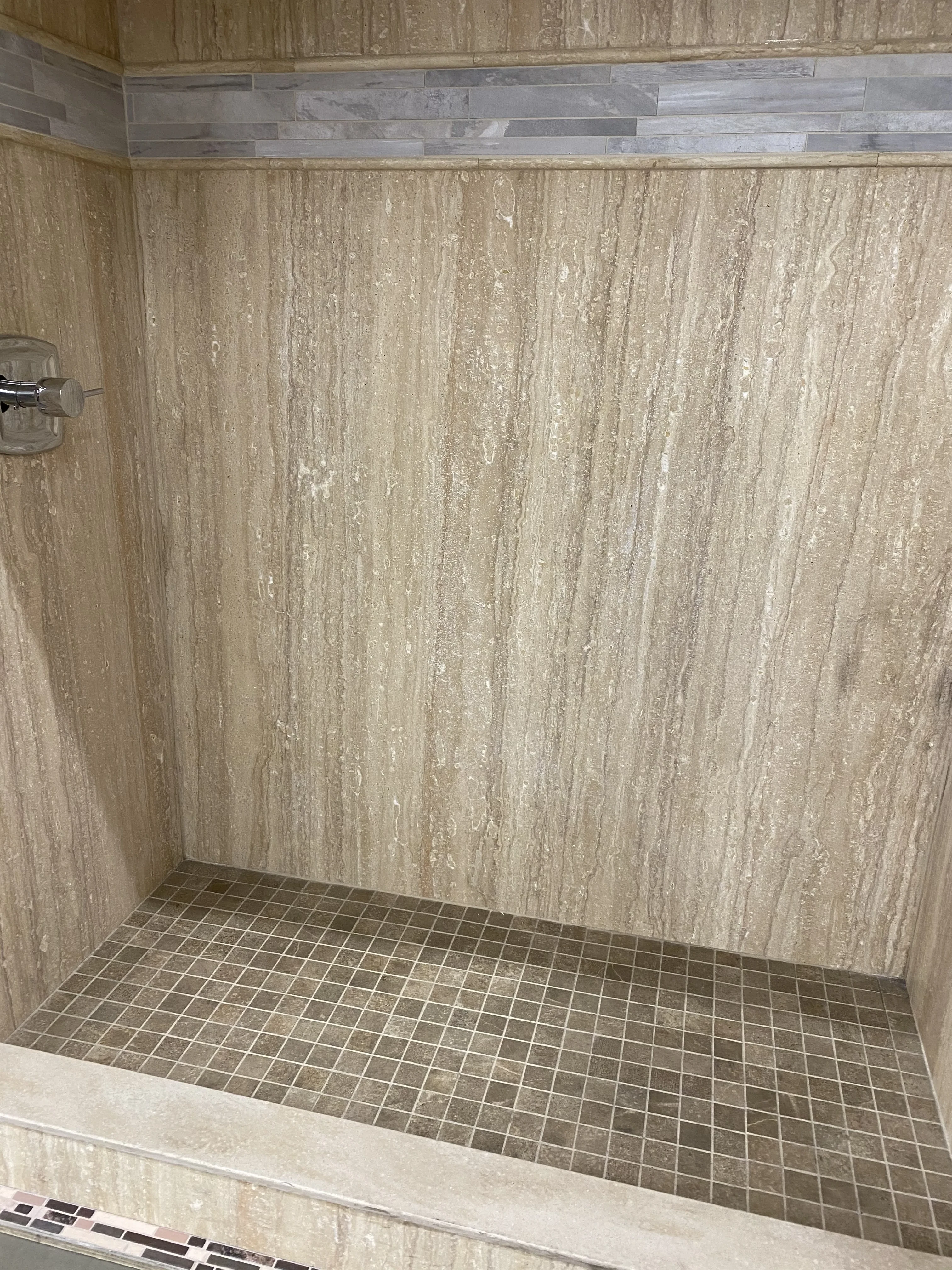 Travertine and Mosaic Grid Tile Shower